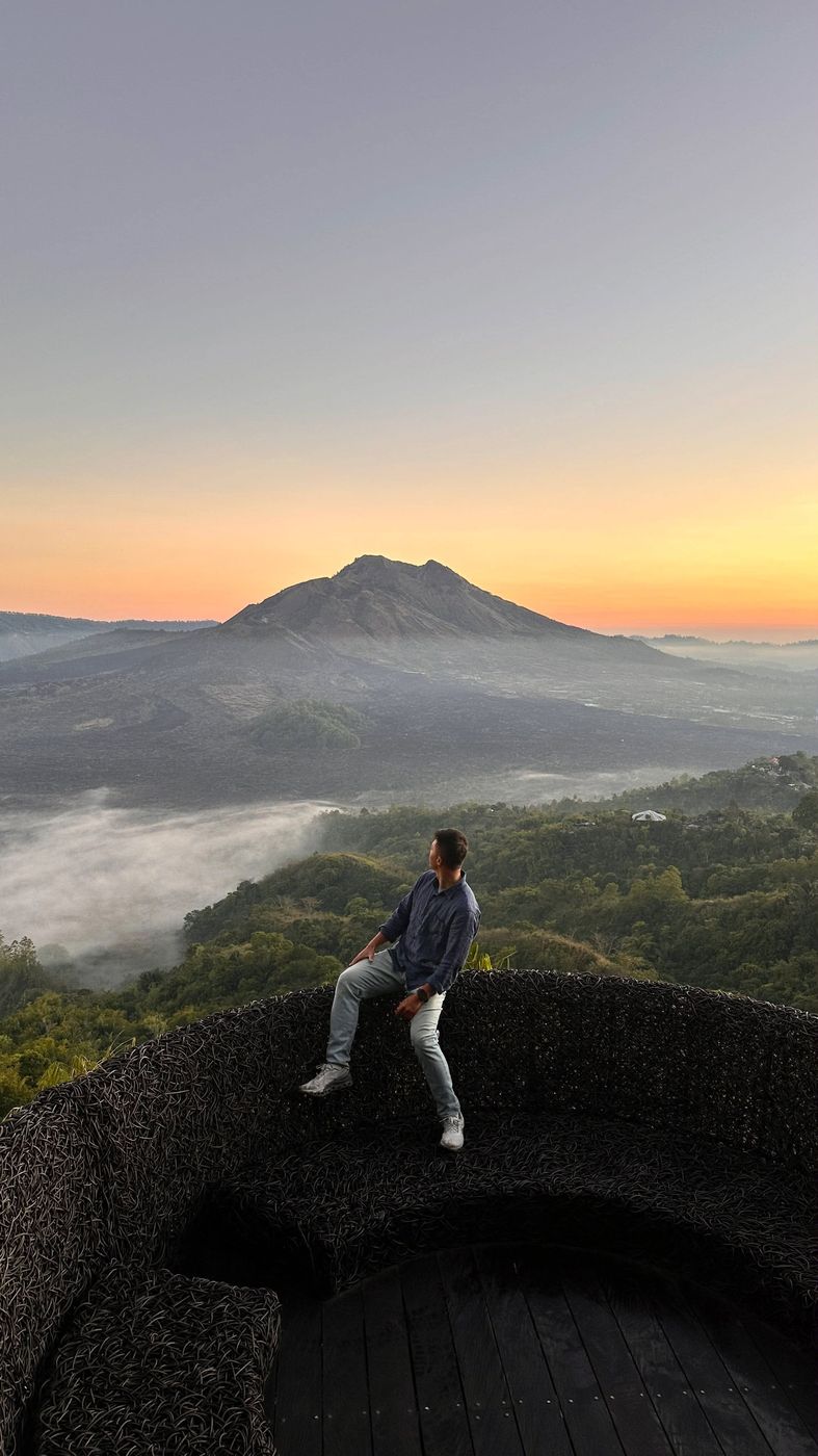 Andrew watching sunrise over Mount Batur, Bali.